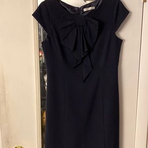 Navy blue casual dress. Decorative bow in front with short sleeves.